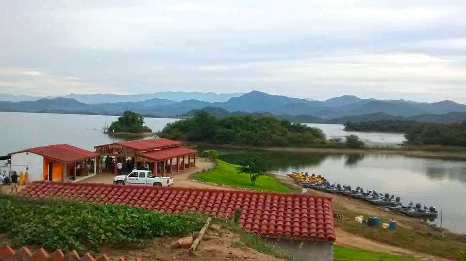 View of Lake Picachos, Mexico from our lodge houses. See our restaurant and bass boats below. Breathtaking view and beautiful lake. Oh yeah, it's FULL of bass too!